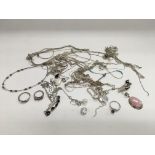 A collection of silver jewellery including various