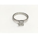 A platinum and solitaire diamond ring marked 950 s