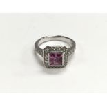 An 18ct white gold pink tourmaline and diamond rin