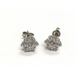 A pair of 18ct white gold diamond cluster earrings
