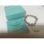 A silver Tiffany & Co bracelet with attached penda