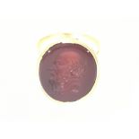 A gold ring inset with intaglio of male form size