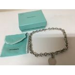 A silver Tiffany & Co necklace with heart pendent