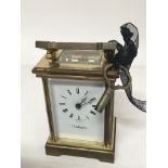 A brass cased Wellington carriage clock.
