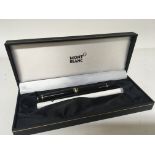 A genuine Mount Blanc pen in a fitted box.