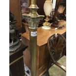 A brass standard lamp the column on square base on