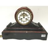 A Victorian black slate and marble mantel clock with a visible escapement. 45cm wide