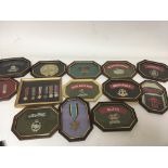 A collection of framed military regimental badges