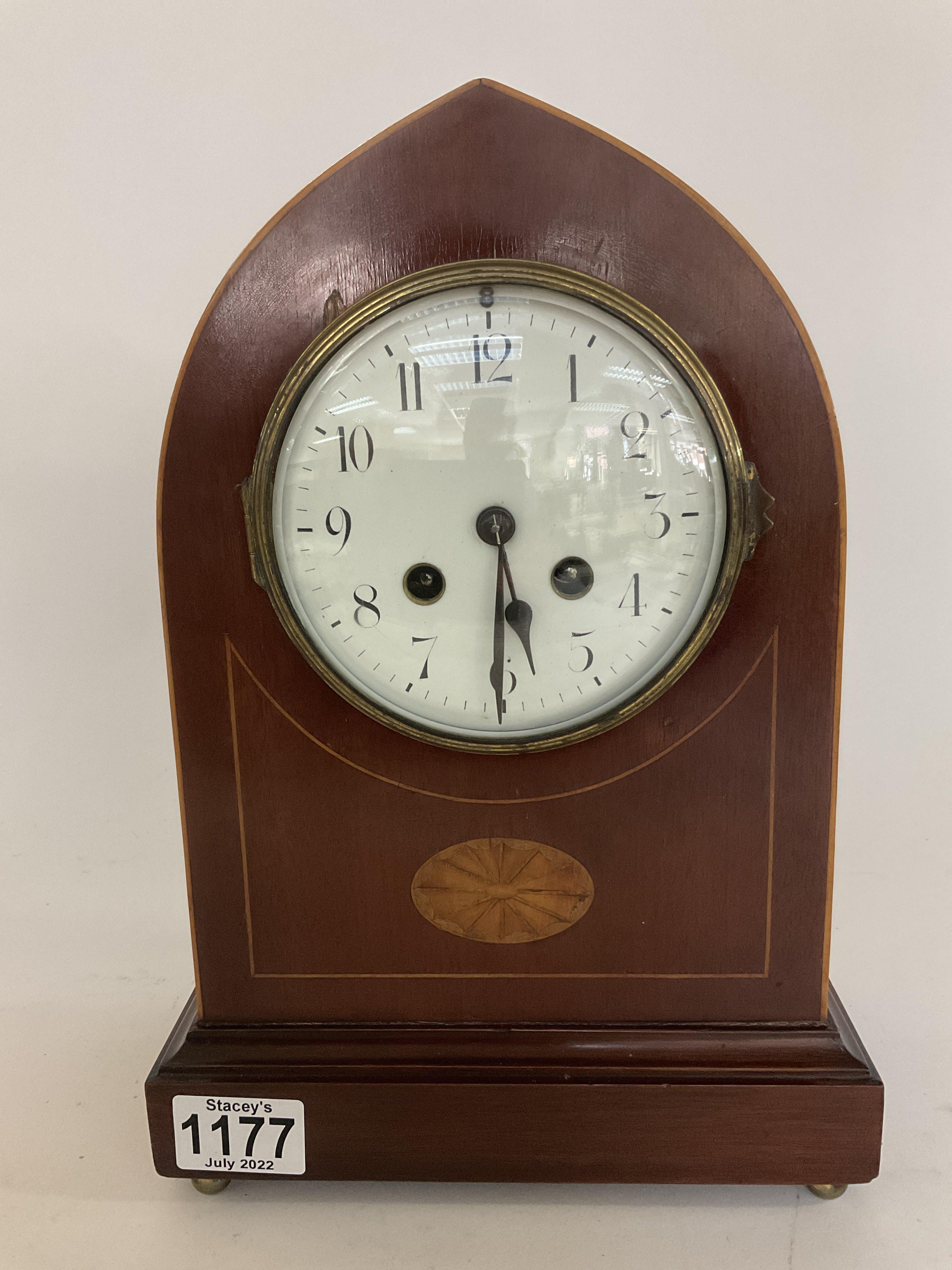 An Edwardian inlaid arch topped mantle clock, 31cm