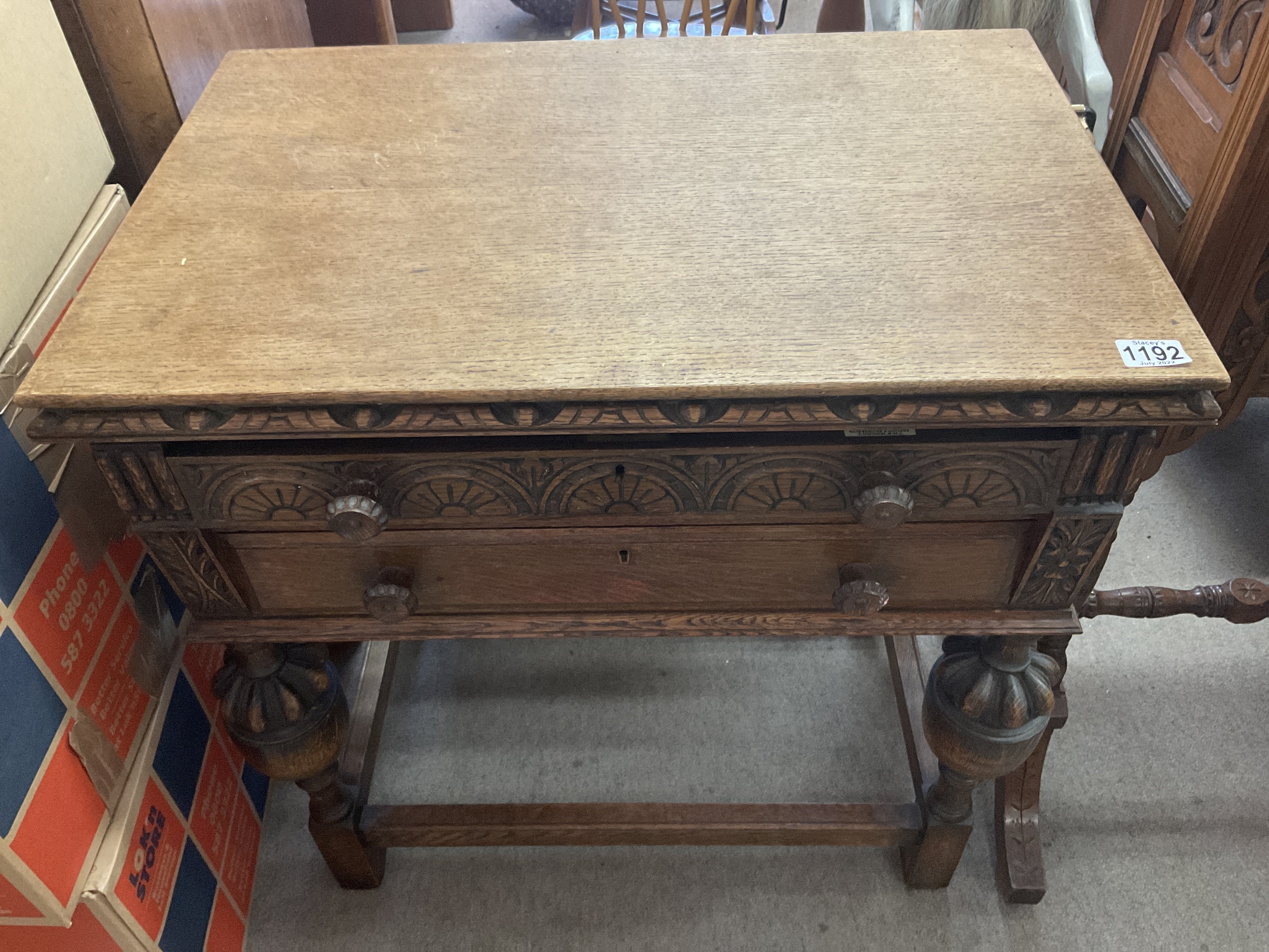 A 1930s 2 draw oak cutlery cabinet retailed at Har