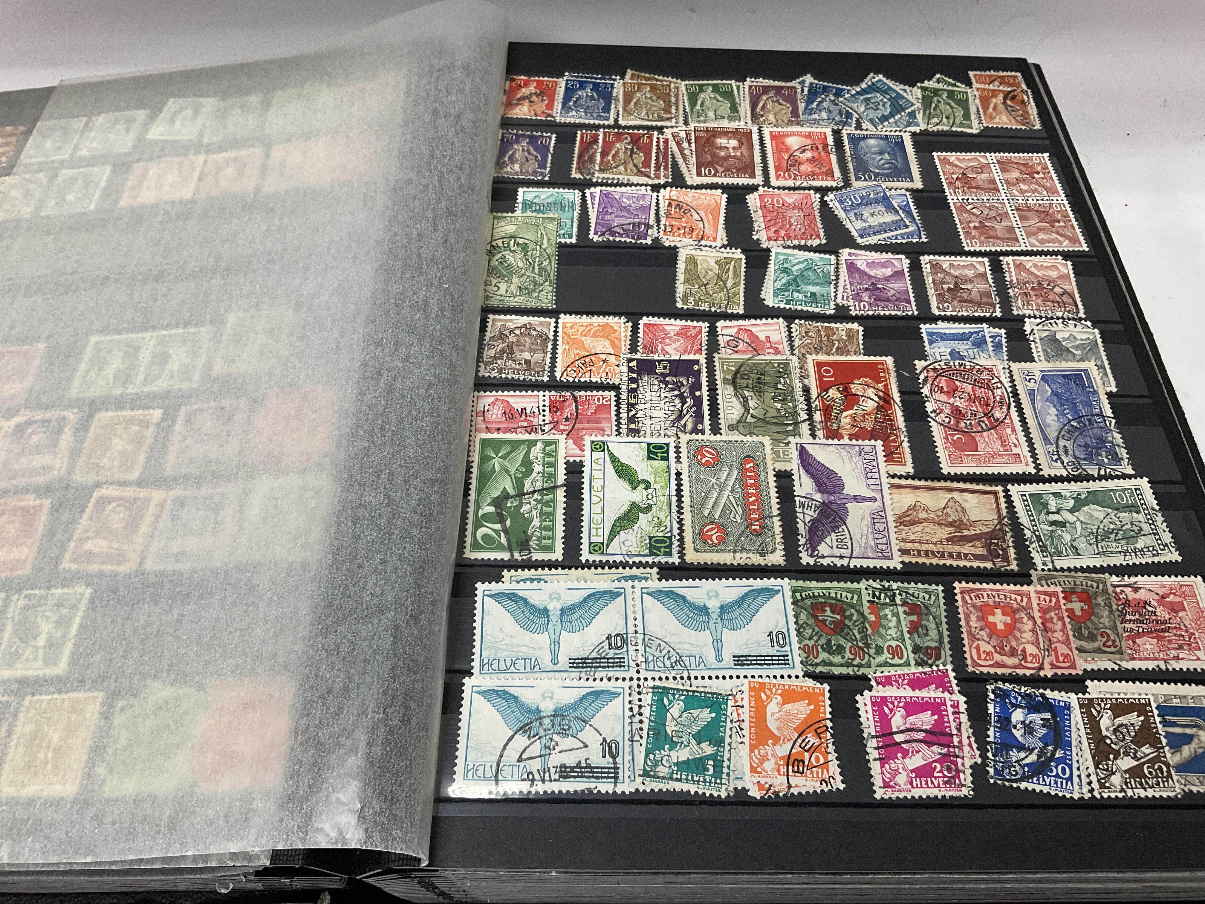 A large stock book includes Switzerland and Italy stamps. - Image 2 of 3