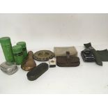 A collection of military items a copper powder fla