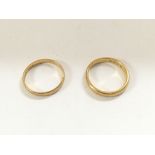 A pair of 22ct wedding rings. Total weight approxi