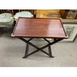 A reproduction campaign folding table. Stands appr