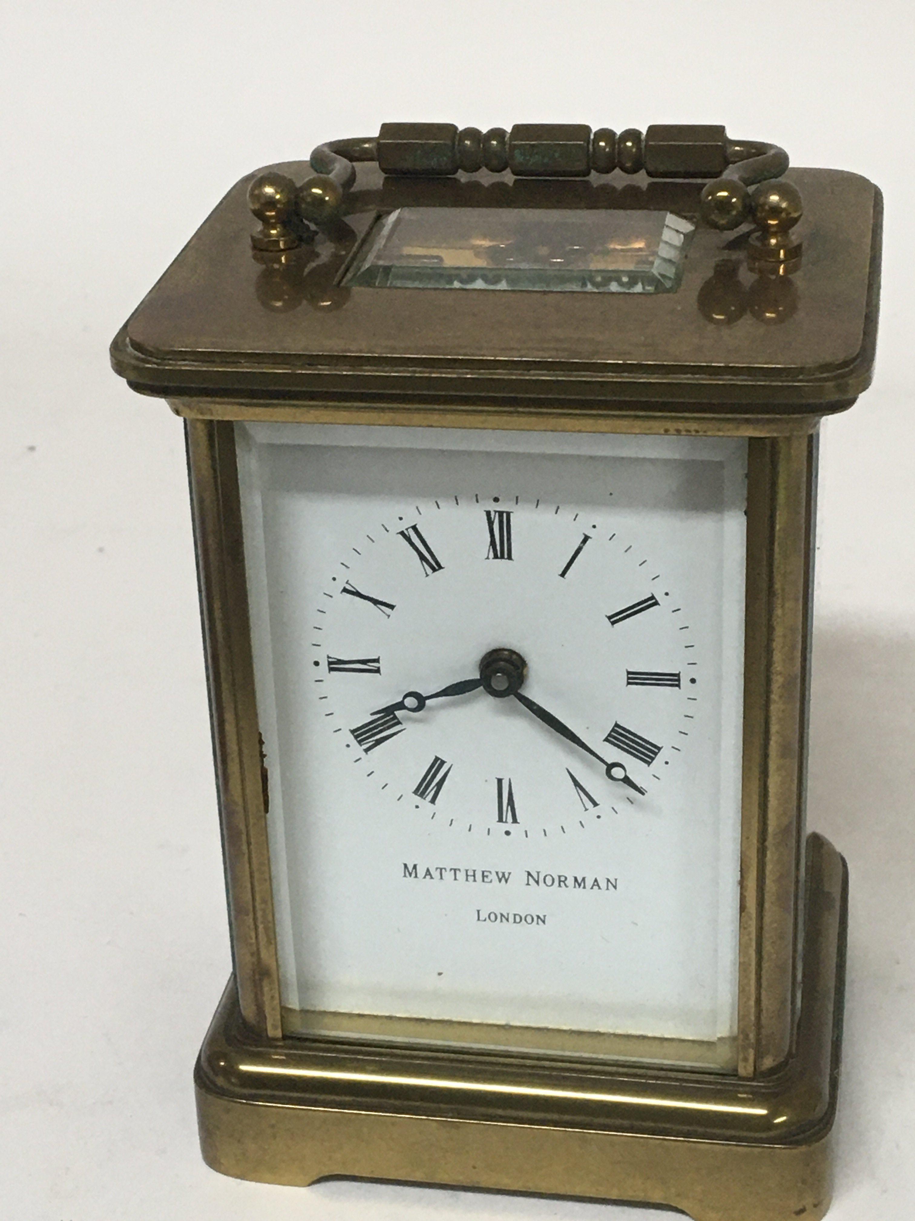 A Mathew Norman London brass cased carriage clock.