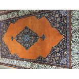 A eastern rug with floral and geometric design on