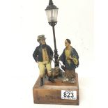 An unusual early 20th century table lamp with painted metal figures East meets West with a pug dog