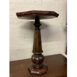 A small flamed mahogany pedastal wine table. 60cm.