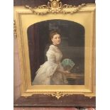 A framed Victorian portrait of a lady three quarter length in a gilt frame and outer velvet frame.