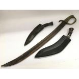 A naval sword and scabbard together with two jambi