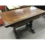 A Victorian Rosewood card table the rectangle top above square supports United by stretchers .