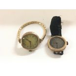 A pair of vintage gold watches.