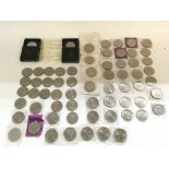 A large collection of various coins including 4 x