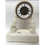 A French alabaster clock with swinging cherub make