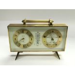 A Swiza 8 day 7 jewels desk clock and barometer, a