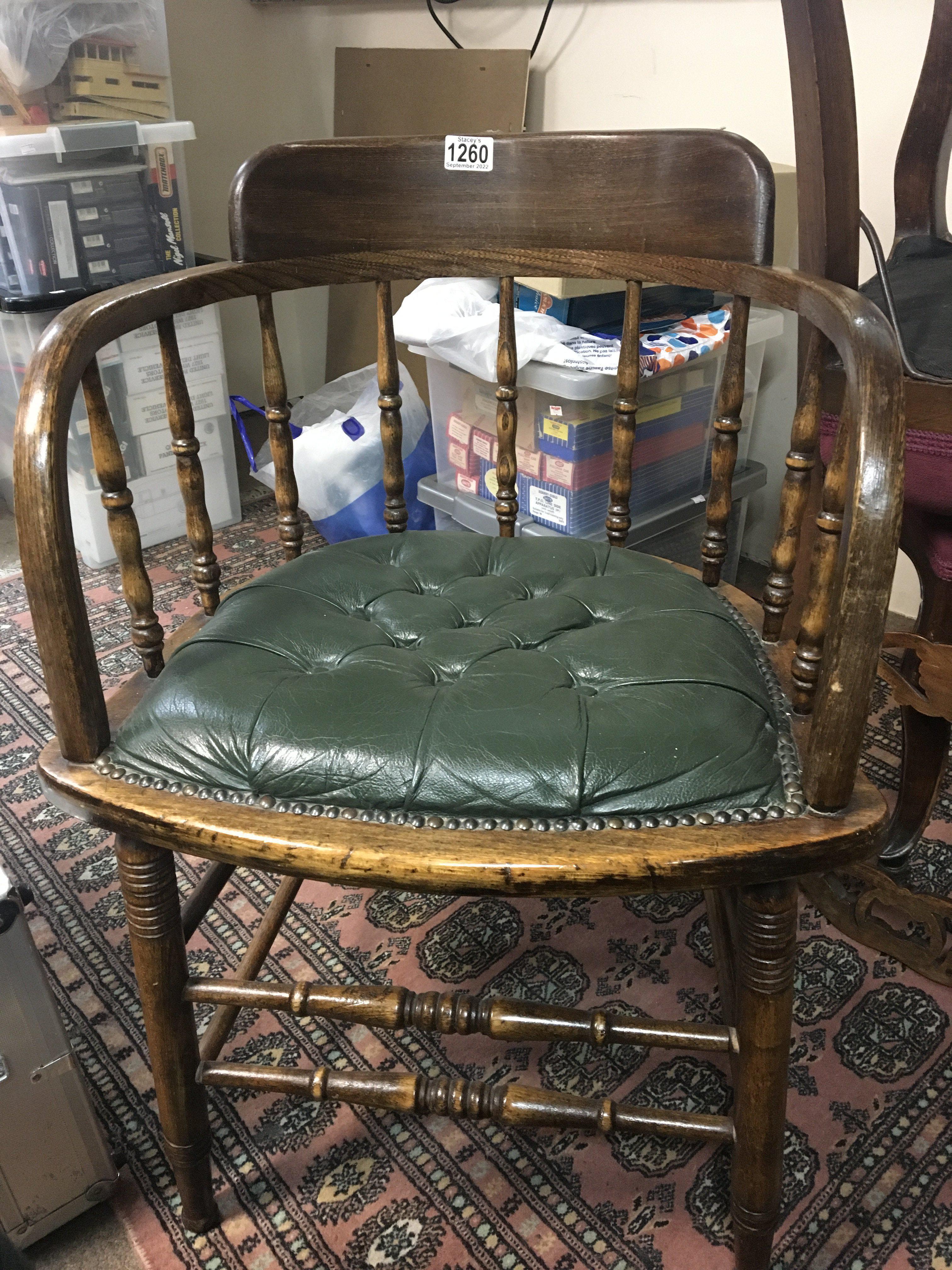 An Edwardian office desk bentwood arm chair with g