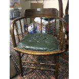 An Edwardian office desk bentwood arm chair with g