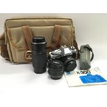 A Minolta X300 camera, lenses and accessories.