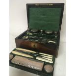 A Quality late Victorian rosewood traveling case with a well fitted interior with numerous