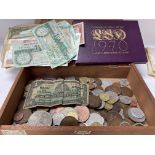 A box of world mixed coinage and banknotes