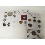 A collection of Scottish military badges and Scott