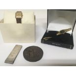 A Silver money clip, Victorian 1887 commemorative medallion and two ladies watches.