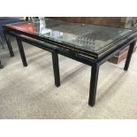 A Piere Vandel glass top table .