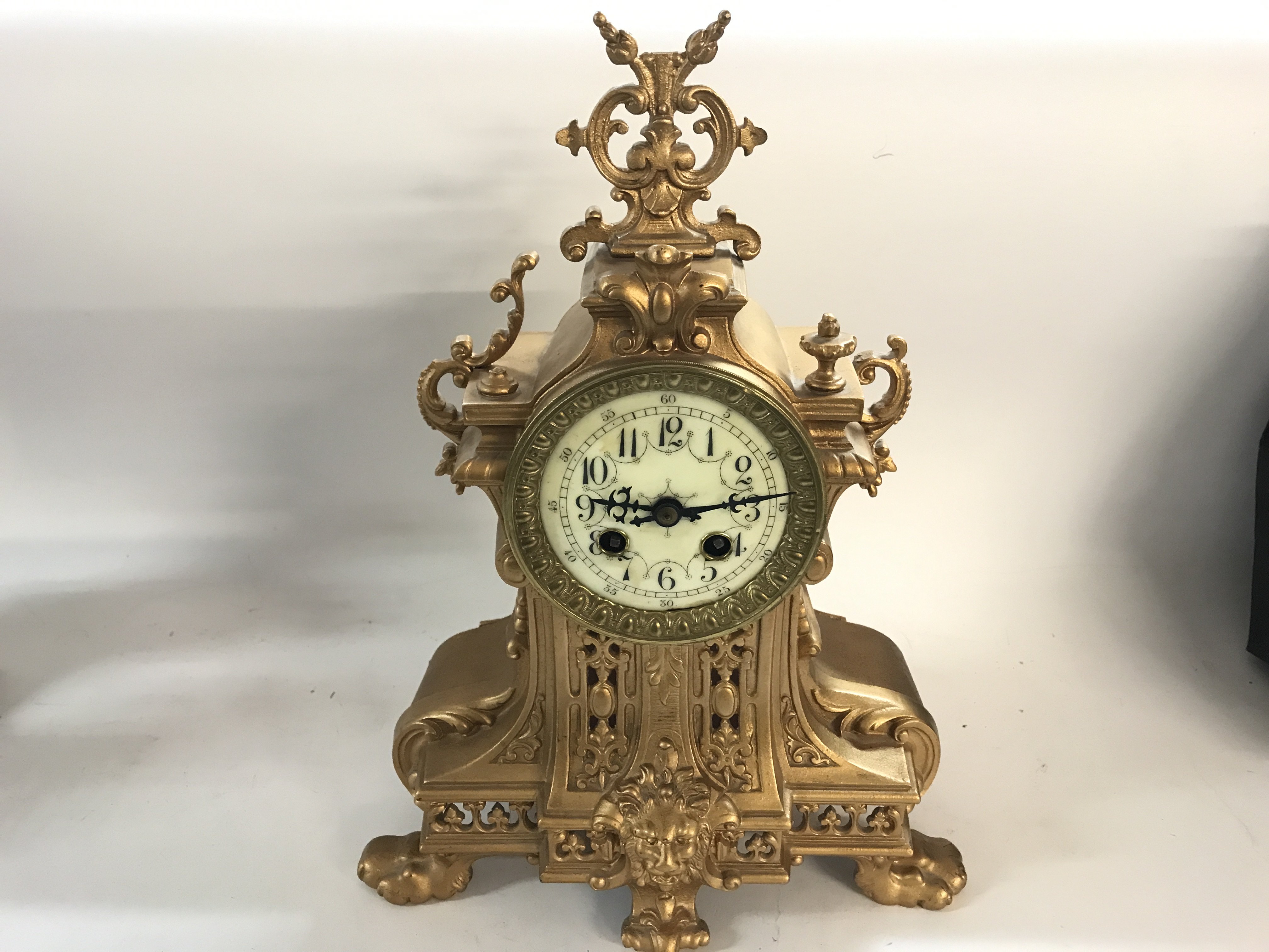 A gilt metal French clock.