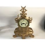 A gilt metal French clock.