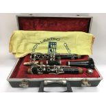 A cased Boosey & Hawkes clarinet.