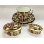 A Royal Crown Derby trio and two graduated pot and