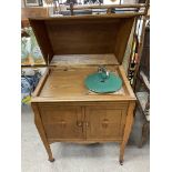 A 1940s oak quarter veneered gramophone with flora