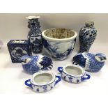 A collection of blue and white ceramic items. Some