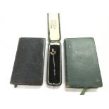 A cased Masonic tie pin and two miniature Masonic