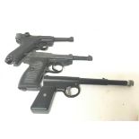 Two replica German Luger Pistols and an air gun. (