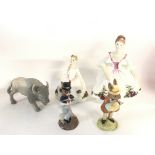 A collection of figures including Royal Doulton Bu