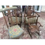 A pair of 1920s beechwood open arm chairs with sha