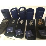 A collection of five Swarovski Crystal Disney orna