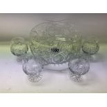 A large cut glass punch/fruit bowl together with 4
