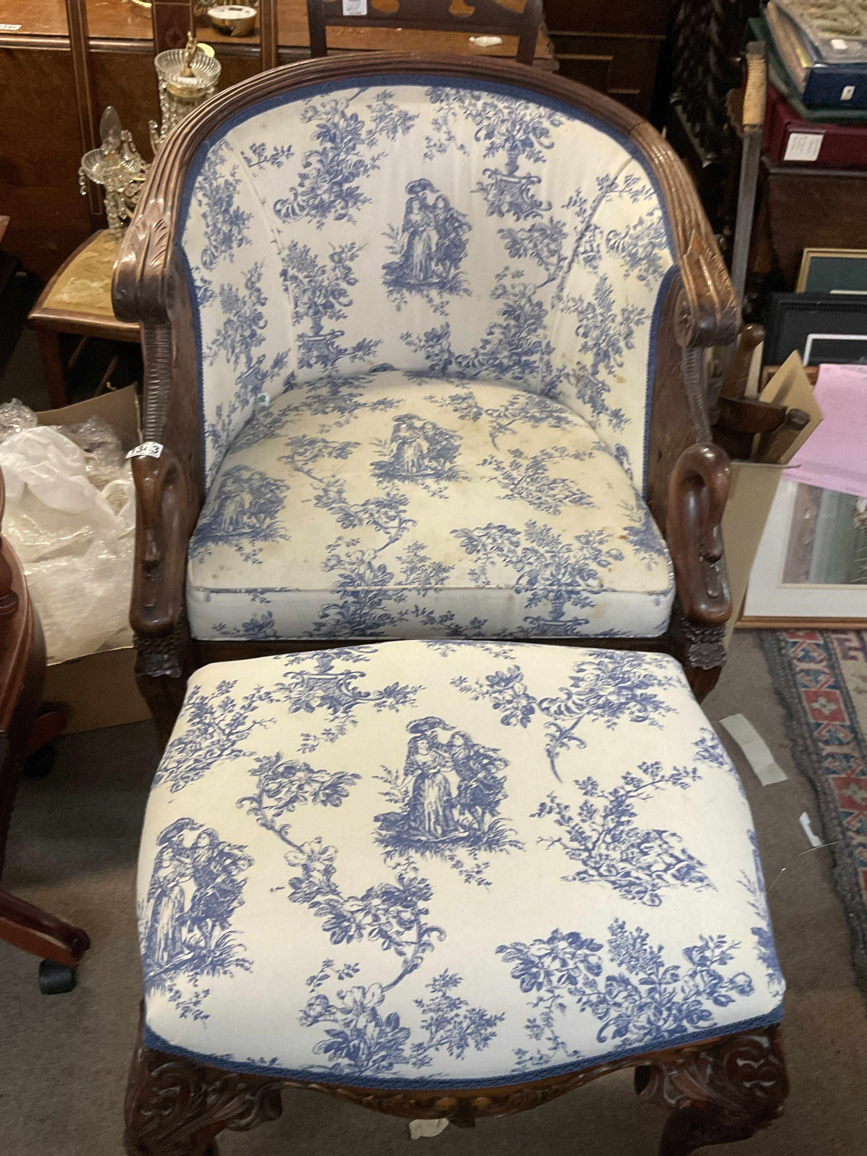 An Empire style blue and white upholstered armchai